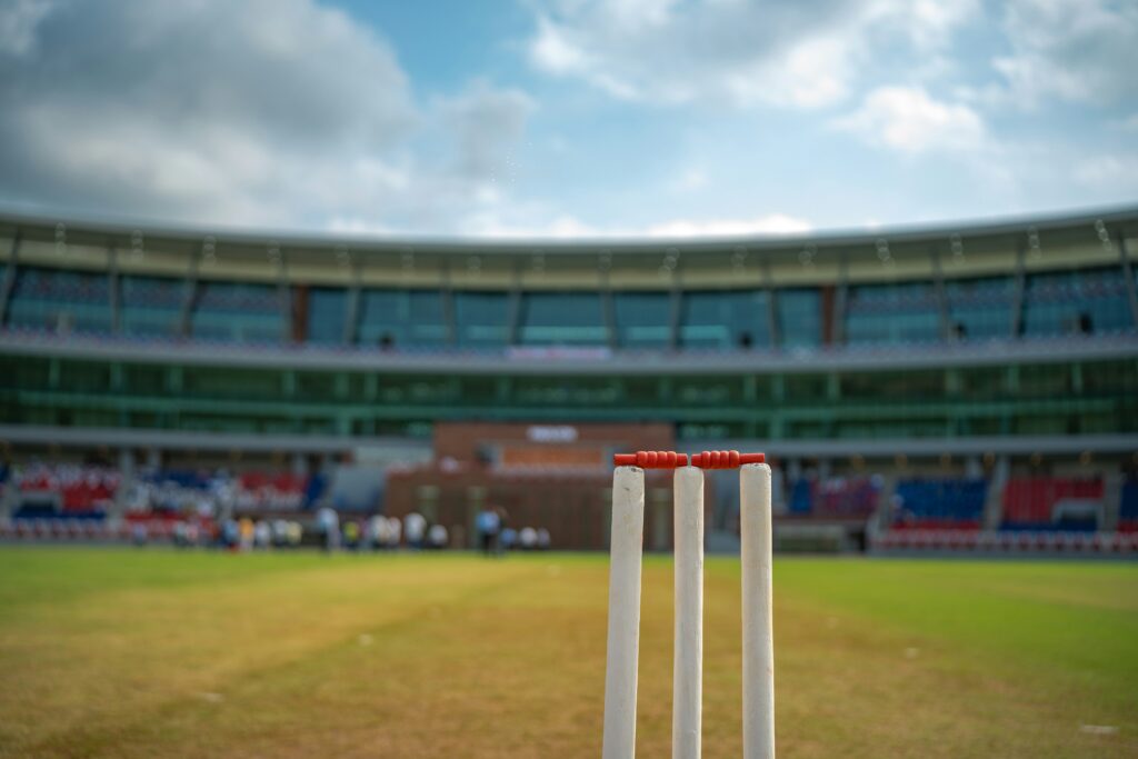 Cricket pitch and stumps in a stadium during a T20 cricket match